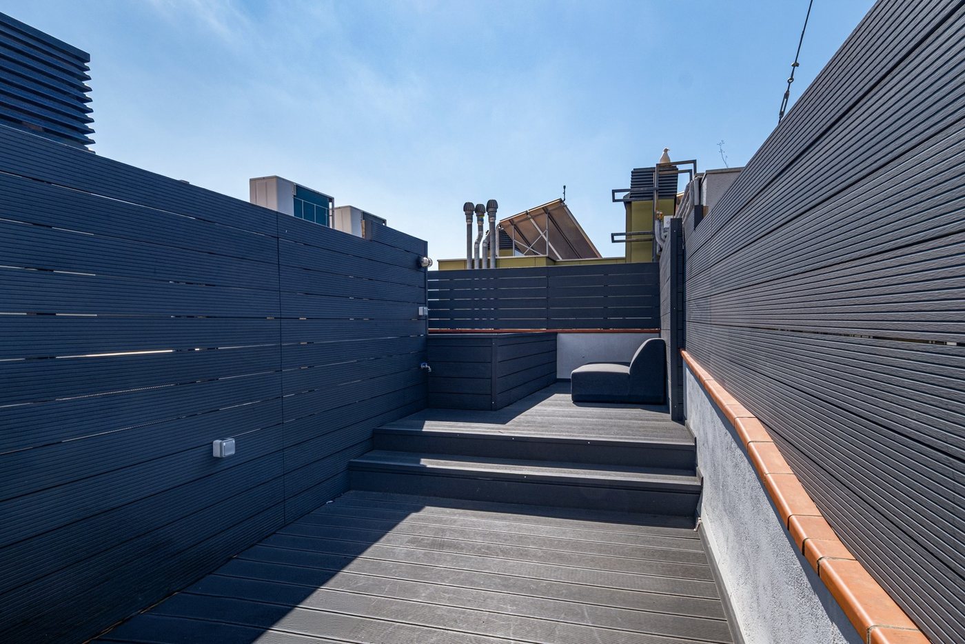 Steps up to the upper level of the rooftop terrace